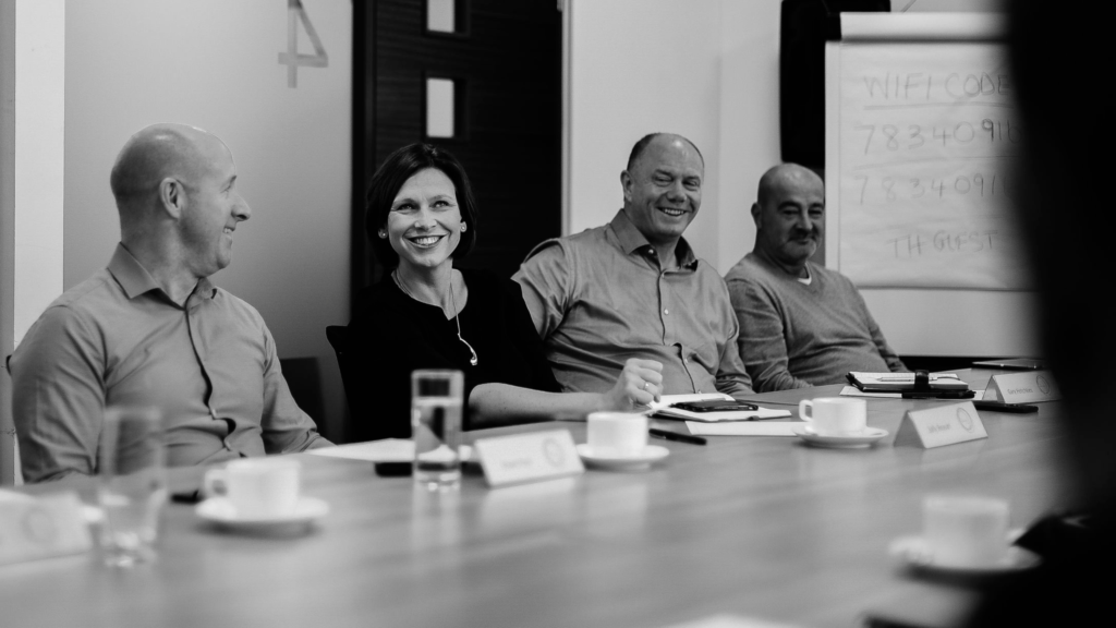 business people sitting around a table